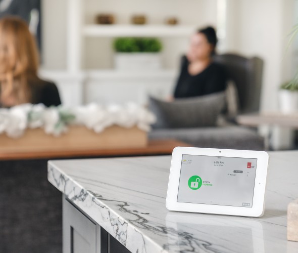 AAA Smart Home Security control panel sitting on a countertop.