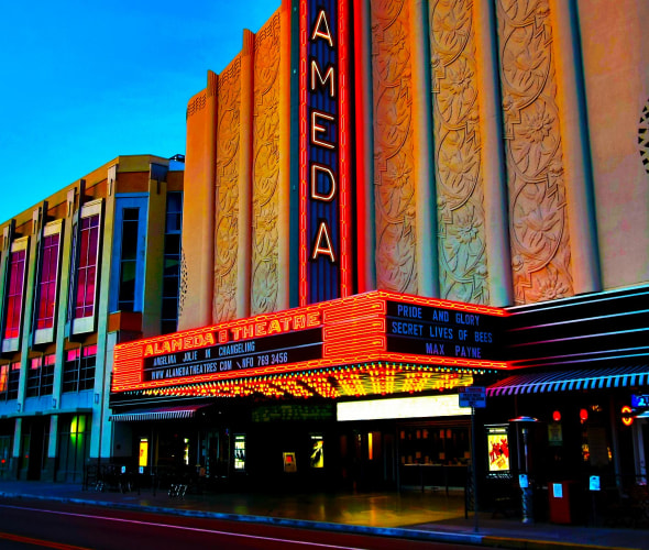 Alameda Theatre & Cineplex lit up at night, picture