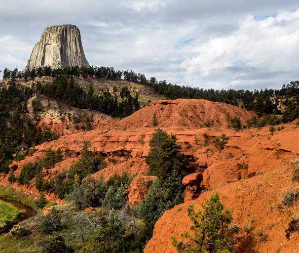 rock monolith looms over Devils Tower National Monument in Wyoming
