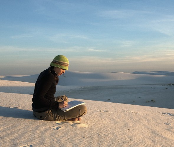 woman sitting on ground sketching at White Sand Dunes National  Monument, New Mexico, picture