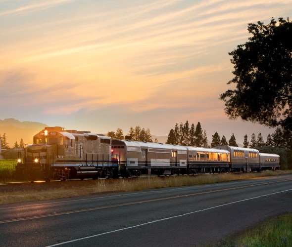 The Wine Train passes the Robert Mondavi Winery's To Kalon vineyard during late afternoon in Oakville, California