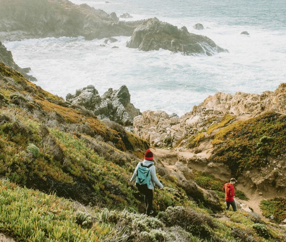 Hikers descend on path above California’s rocky Big Sur coast