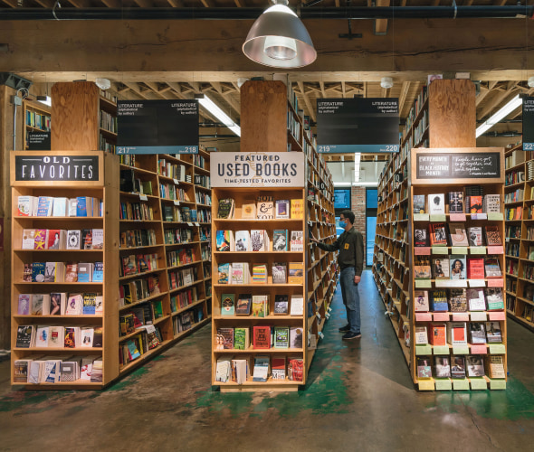 A person browses the shelves at Powell's Bookstore in Portland, Oregon.