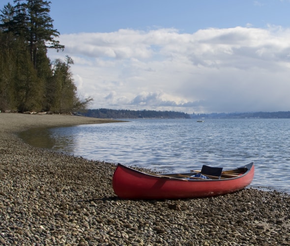 A canoe sits on the shore in Olympia, Washington.