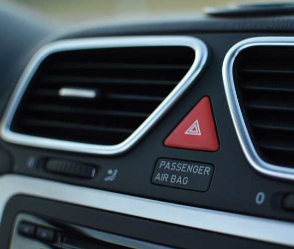 Airbag warning on a vehicle dashboard.