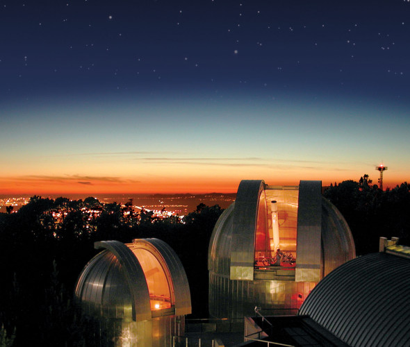 Chabot Space and Science Center at night overlooking downtown Oakland, California.