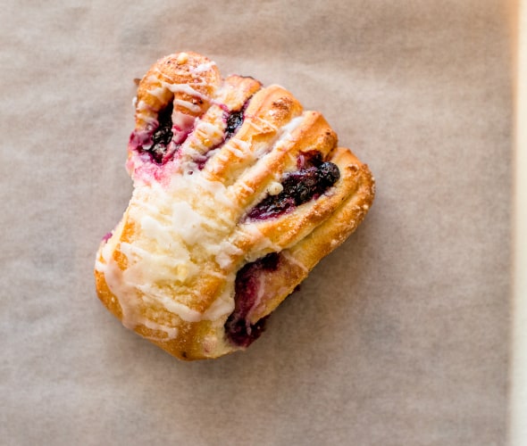 Huckleberry bear claw from Polebridge Mercantile on a piece of parchment paper.