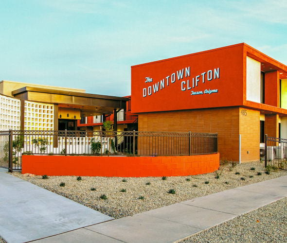 The bright orange facade of the Downtown Clifton Hotel in Tucson.