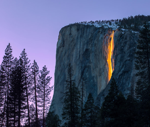 Yosemite National Park's firefall lit up at sunset.