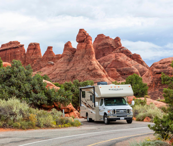 RV parked at a campsite in Devils Garden Campground, Arches National Park, Moab, Utah.