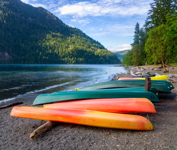 Kayaks on the shore of Lake Crescent in Washington's Olympic National Park.