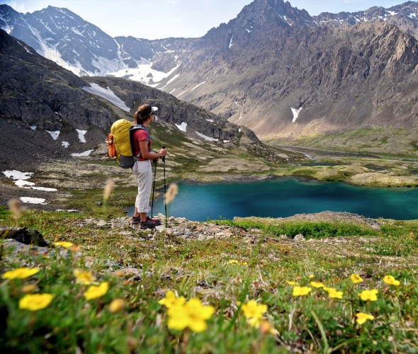A hiker overlooks Williwaw Lakes in Chugach State Park, near Anchorage, Alaska, in summer.