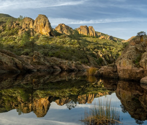 Bear Gulch Reservoir in Pinnacles National Park on a party cloudy day.