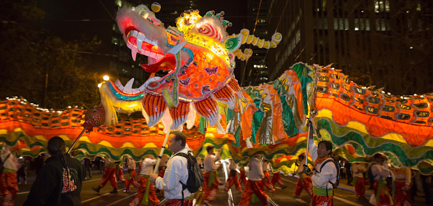 dragon with escorts in Chinese New Year parade at night in San Francisco