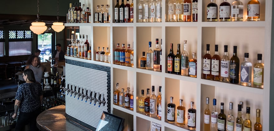 Townshend's Distillery's wall of tea spirits, image