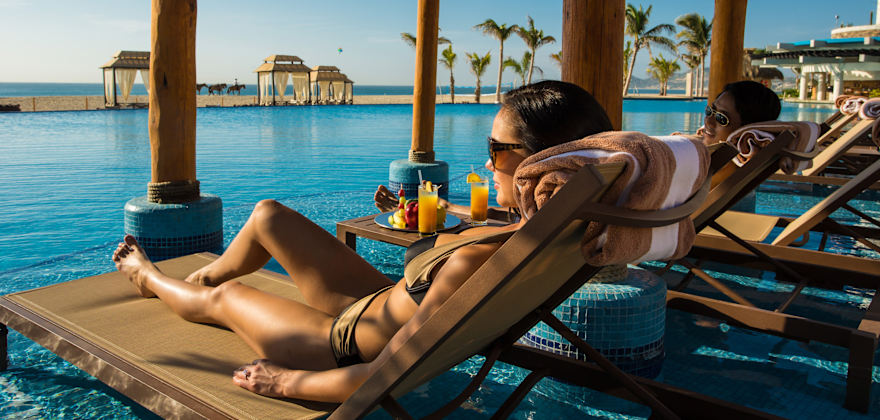 AAA Member lounges at the pool at the Hyatt Ziva Los Cabos.