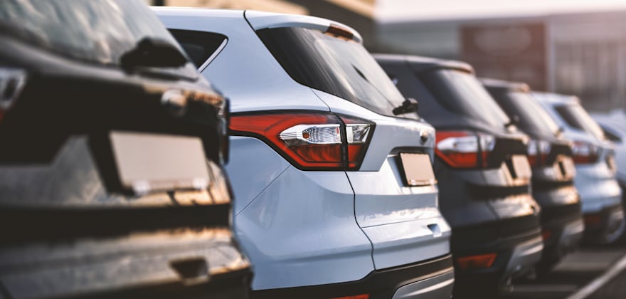 A lineup of cars at a dealership