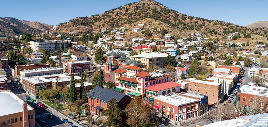 Elevated view across downtown Bisbee, Arizona, on a clear, cloudless day.
