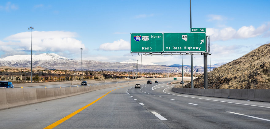 Cars drive on the highway towards Reno, Nevada.