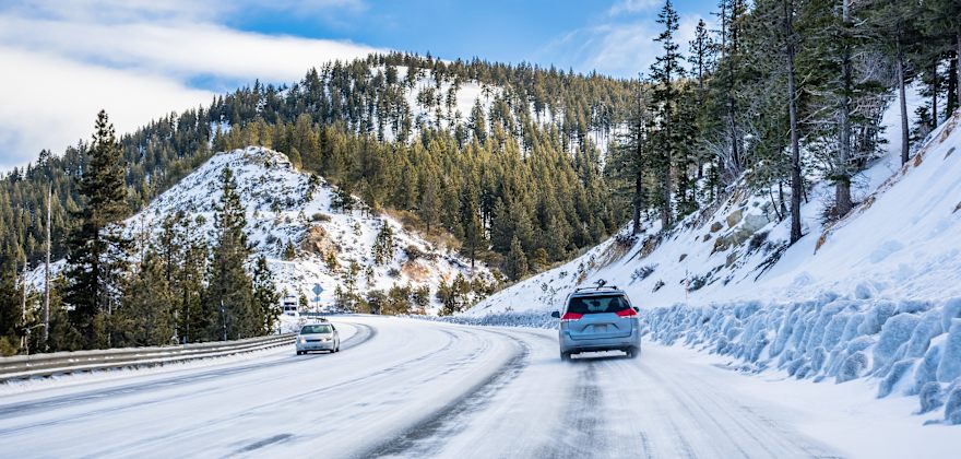 Cars drive on the highway in the Sierra Nevada.