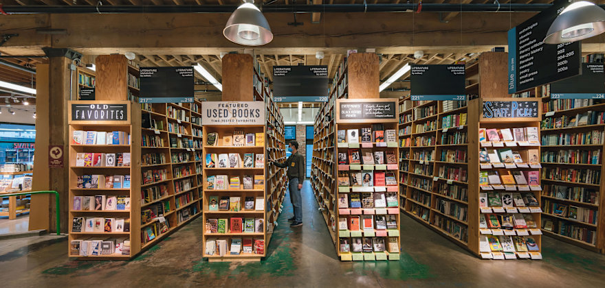 A person browses the shelves at Powell's Bookstore in Portland, Oregon.