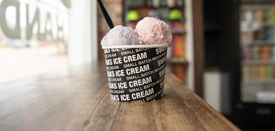 A cup of  oce cream sits on the bar counter at Bozeman's Sweet Peaks West Main location.