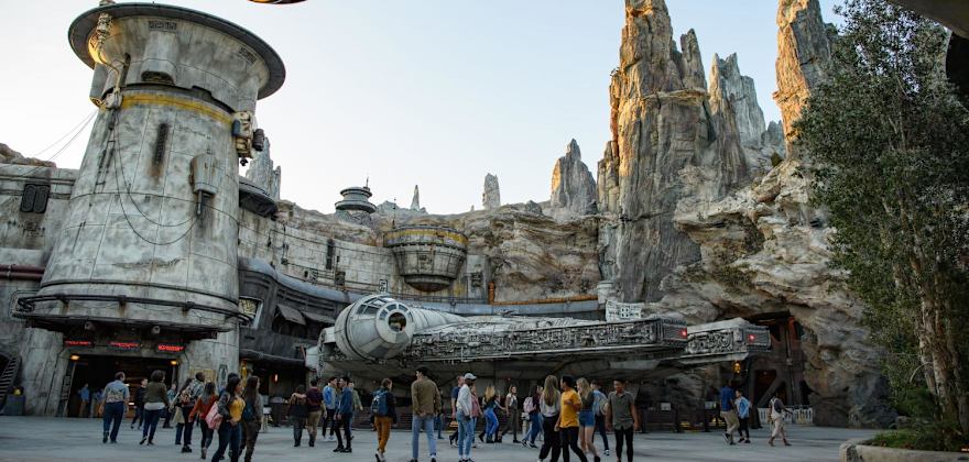 Poeple walk past Star Wars: Galaxy’s Edge at Disneyland Park in Anaheim, California.