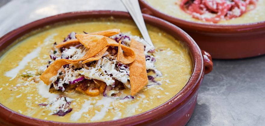 the spicy potato and corn chowder with toppings at Gadzooks Enchiladas & Soup in Phoenix, Arizona