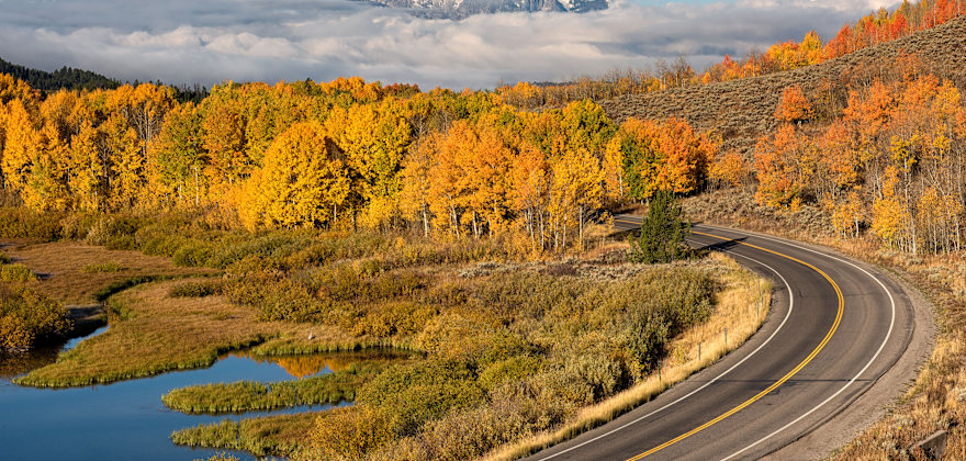 Mt. Moran overlooks a winding road in Wyoming's Teton National Park.