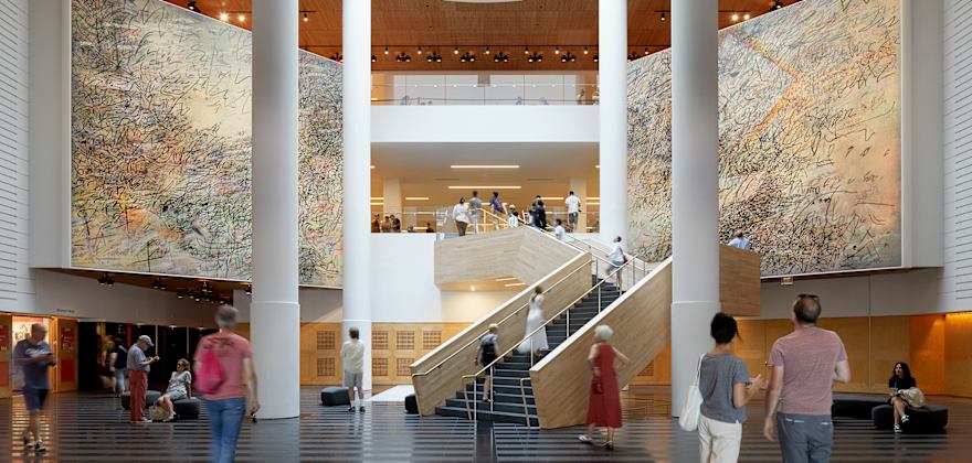 People wander inside SFMOMA.
