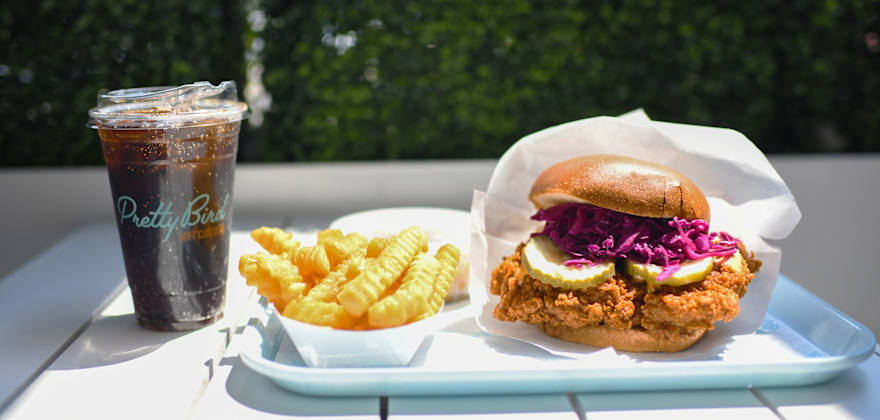 Fried chicken sando combo outside at Pretty Bird in Salt Lake City.