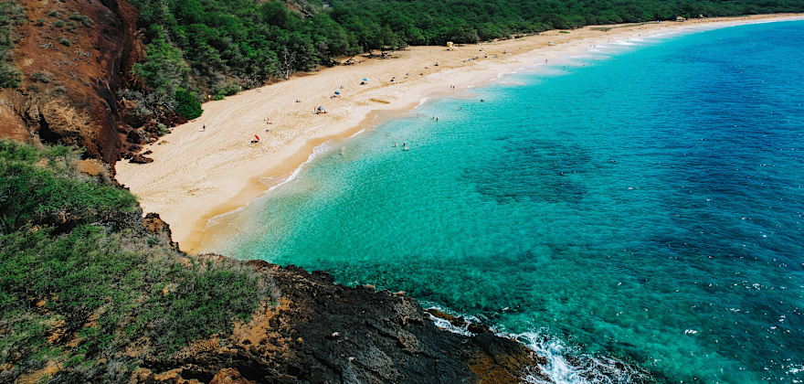 People lounge and play at Big Beach on Maui, Hawaii.