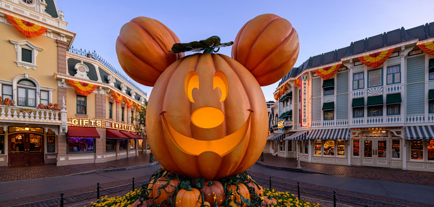 Mickey pumpkin jack-o-lantern statue at Disneyland during Halloween.