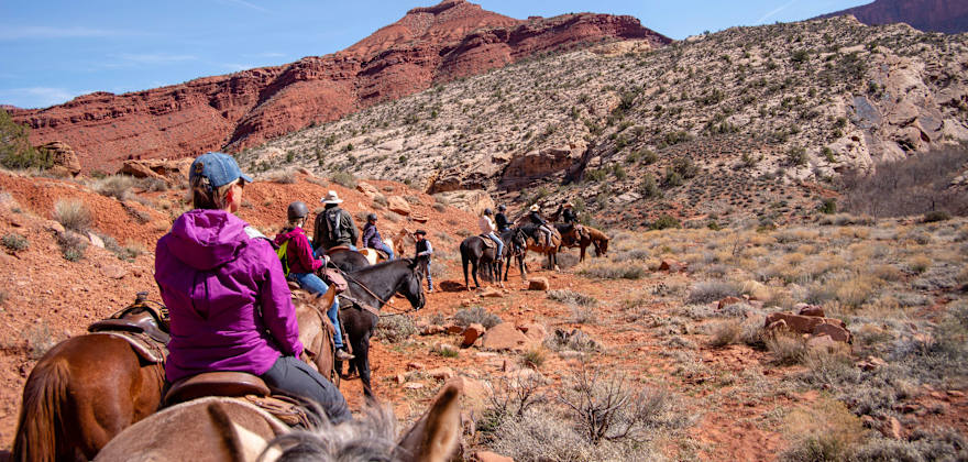Tourists enjoy a trail ride with staff from Red Cliffs Lodge near Moab, Utah.