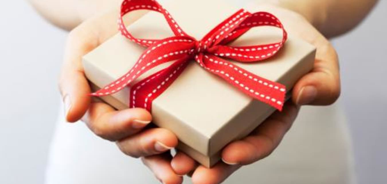 a woman gives a gift of AAA membership