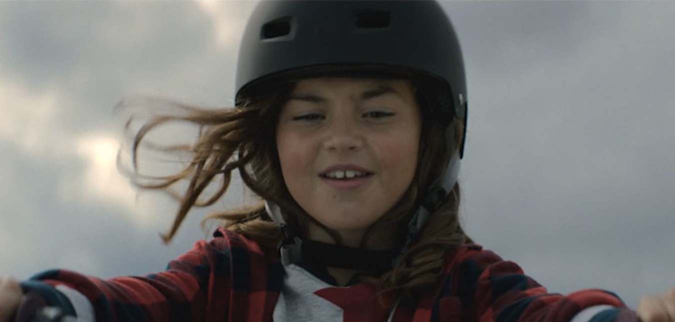 a girl riding a bike from AAA's tv commercial