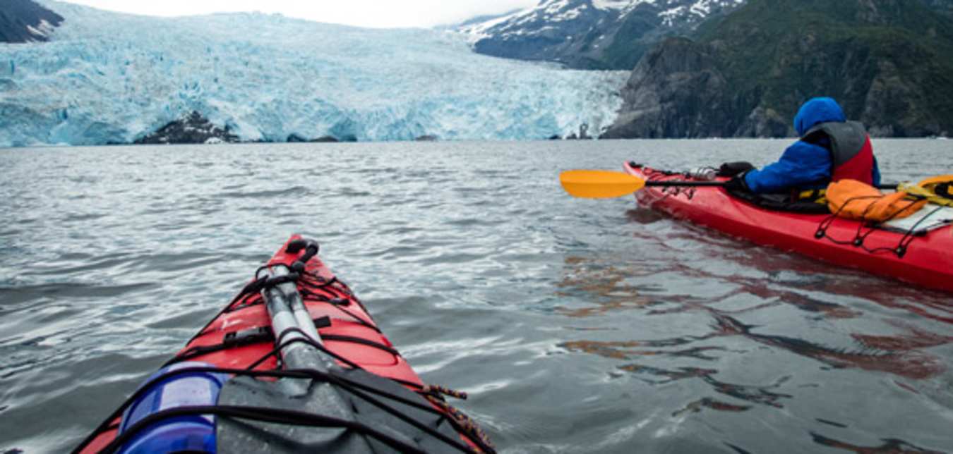 kayak past glaciers on alaska vacations
