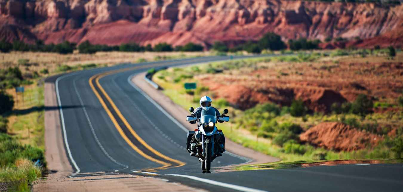 AAA Member riding a desert road