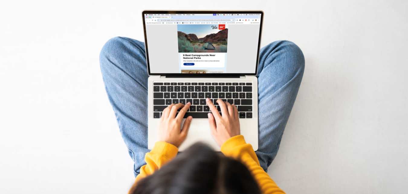 A person person reads the AAA Highlights email on their laptop.