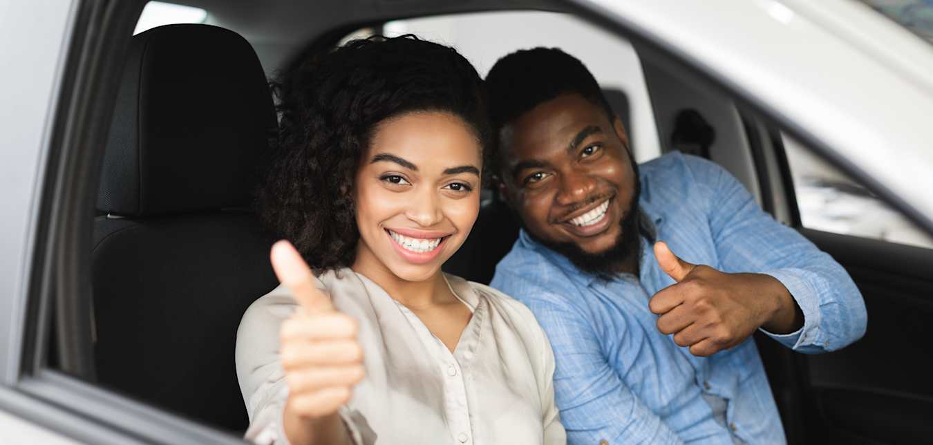 Man and woman sitting in car