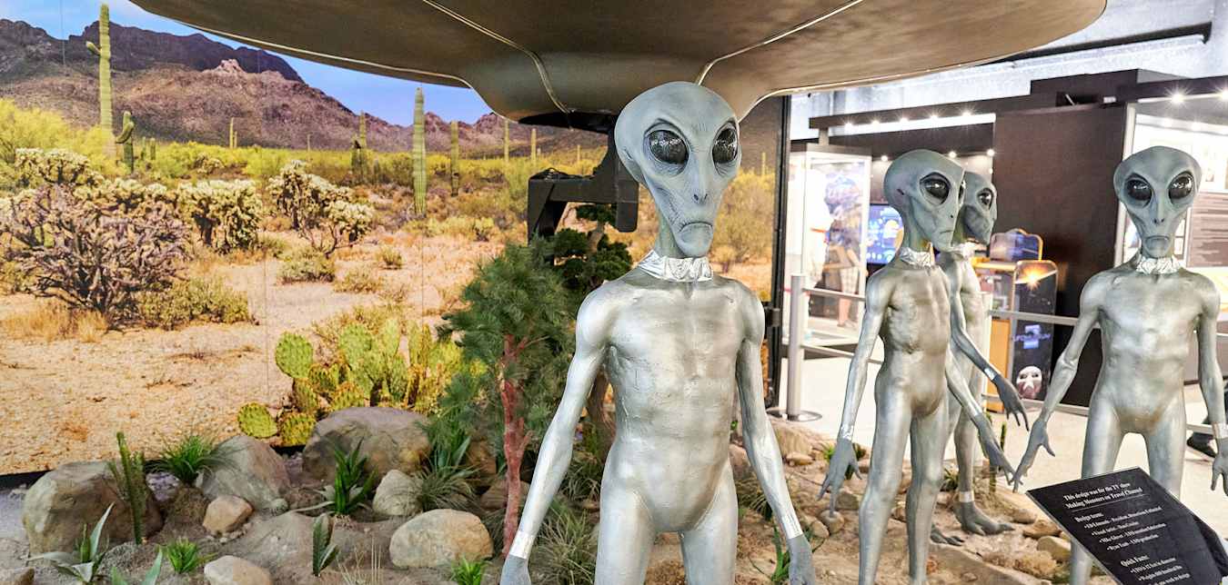 Renditions of aliens in a museum exhibit