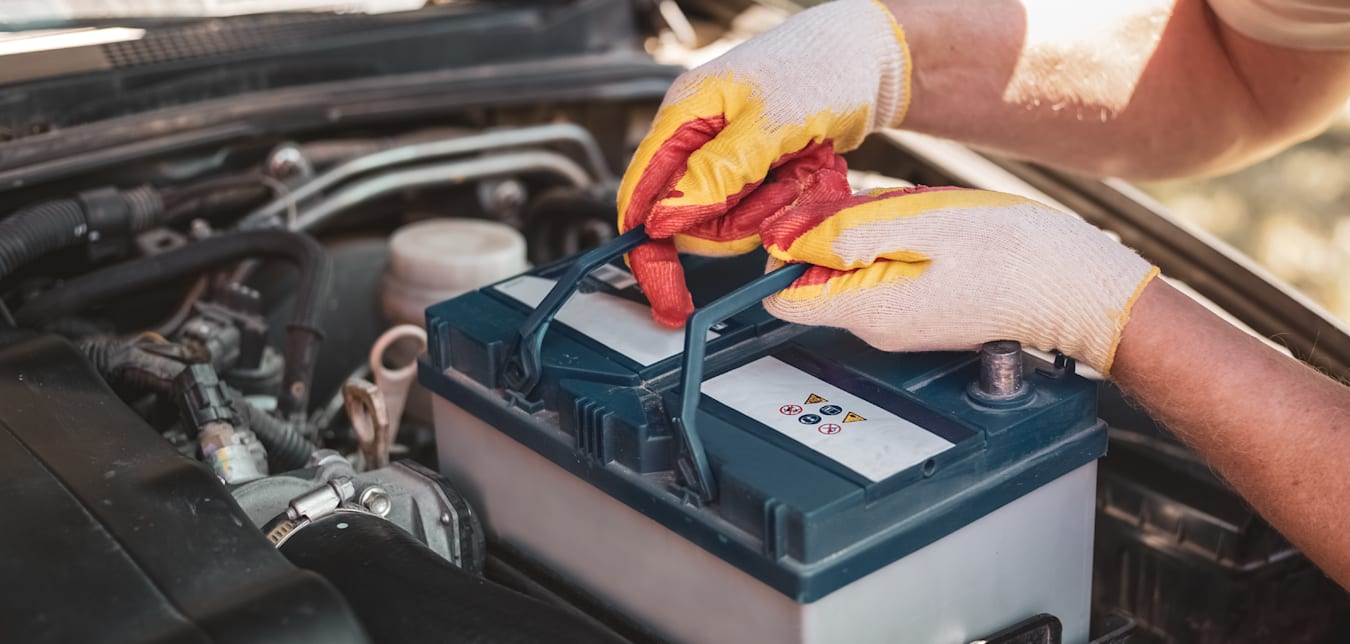 car battery being replaced after following maintenance tips