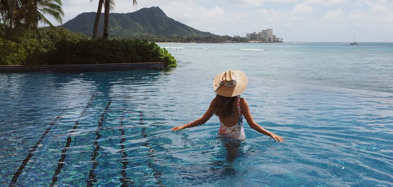 woman in infinity pool at hotel in hawaii