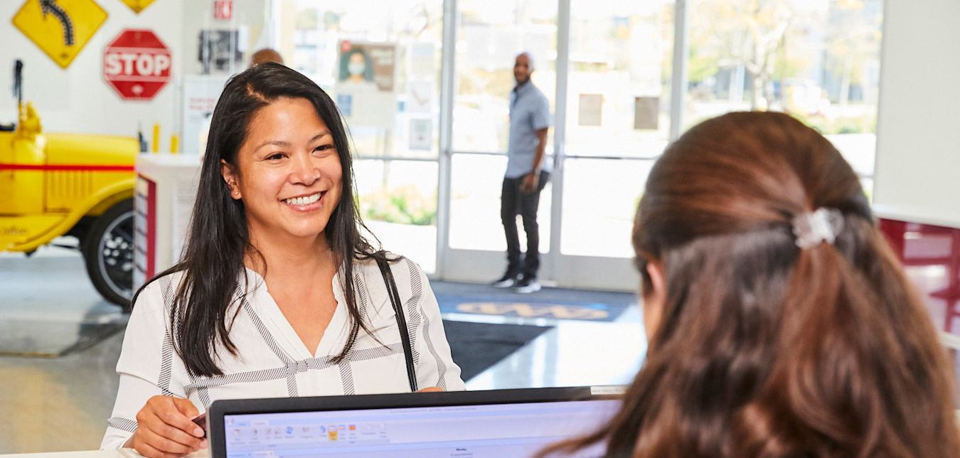 AAA Member is helped at AAA Auto Repair Center front desk.