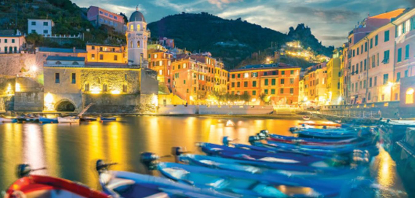 boats floating in port in a european city
