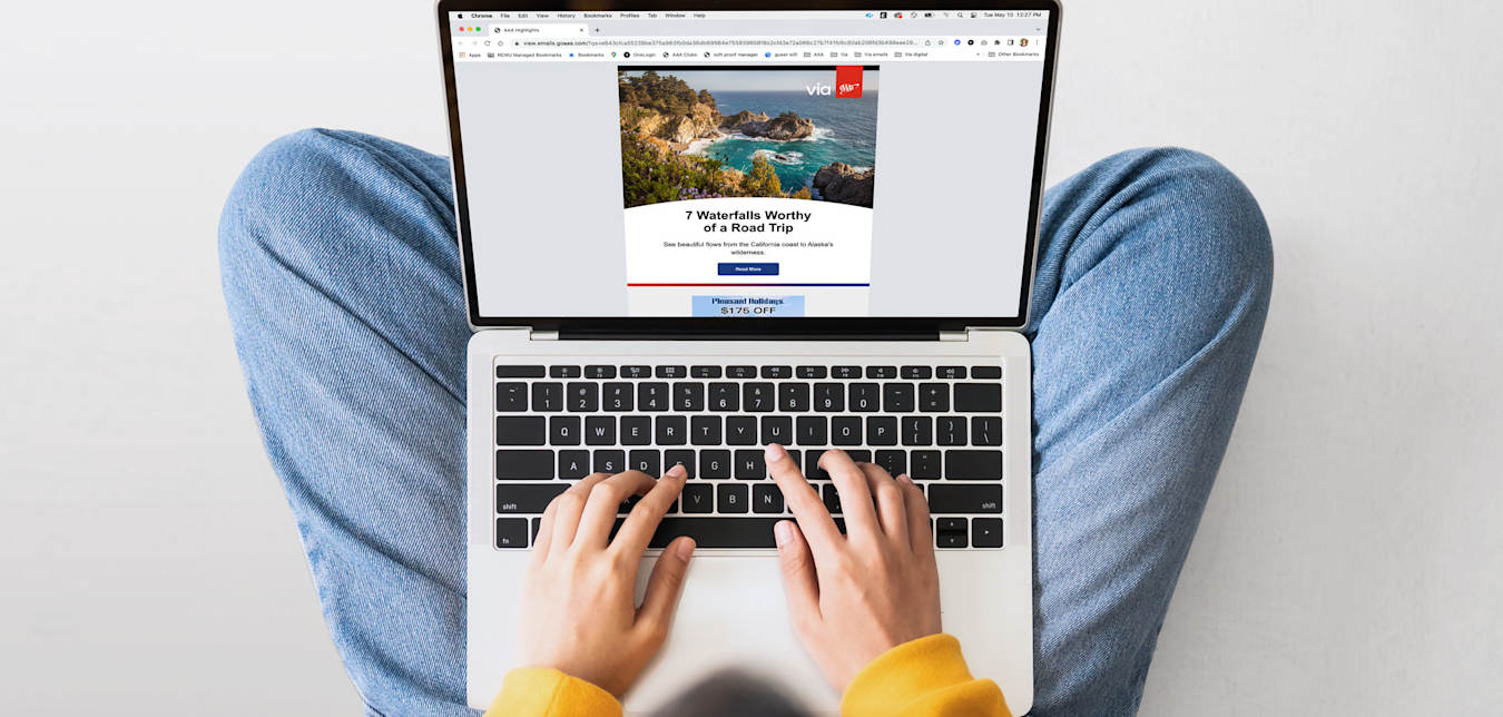 A person person reads the AAA Highlights email on their laptop.