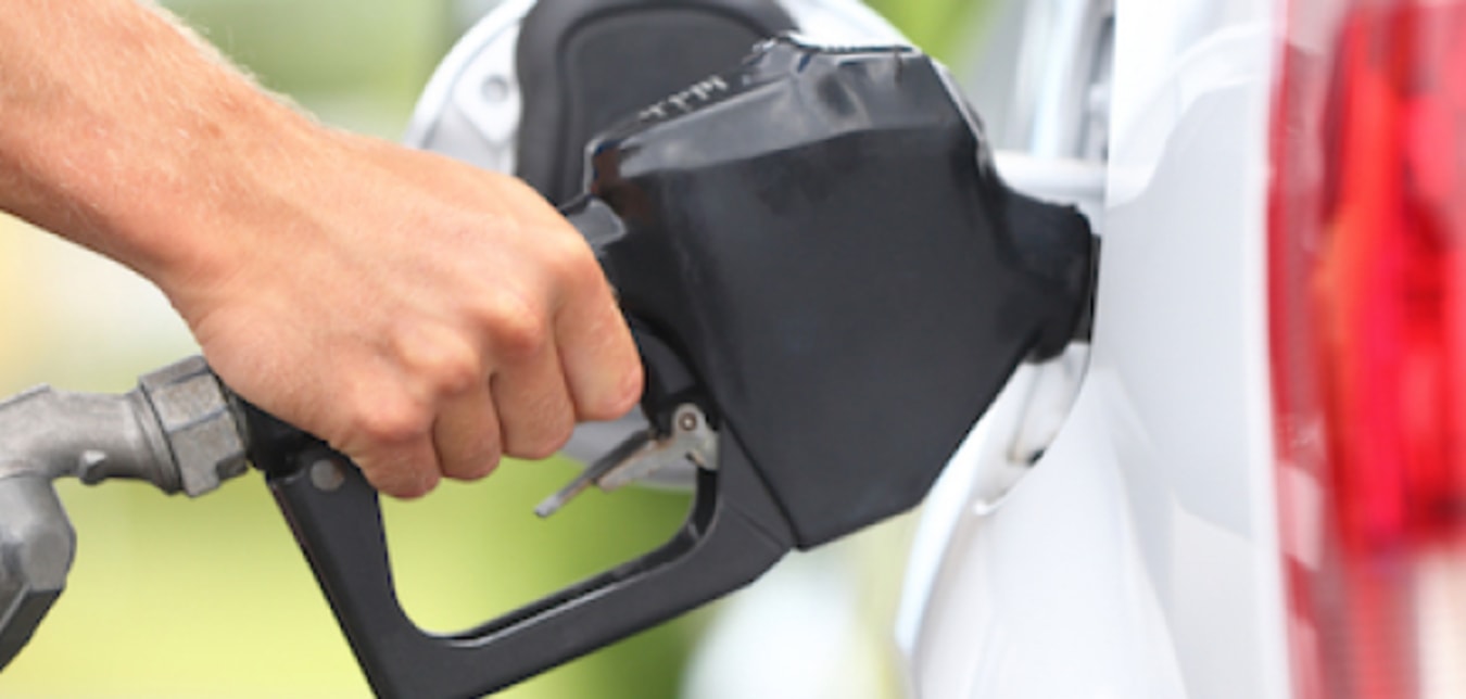 person pumping gas