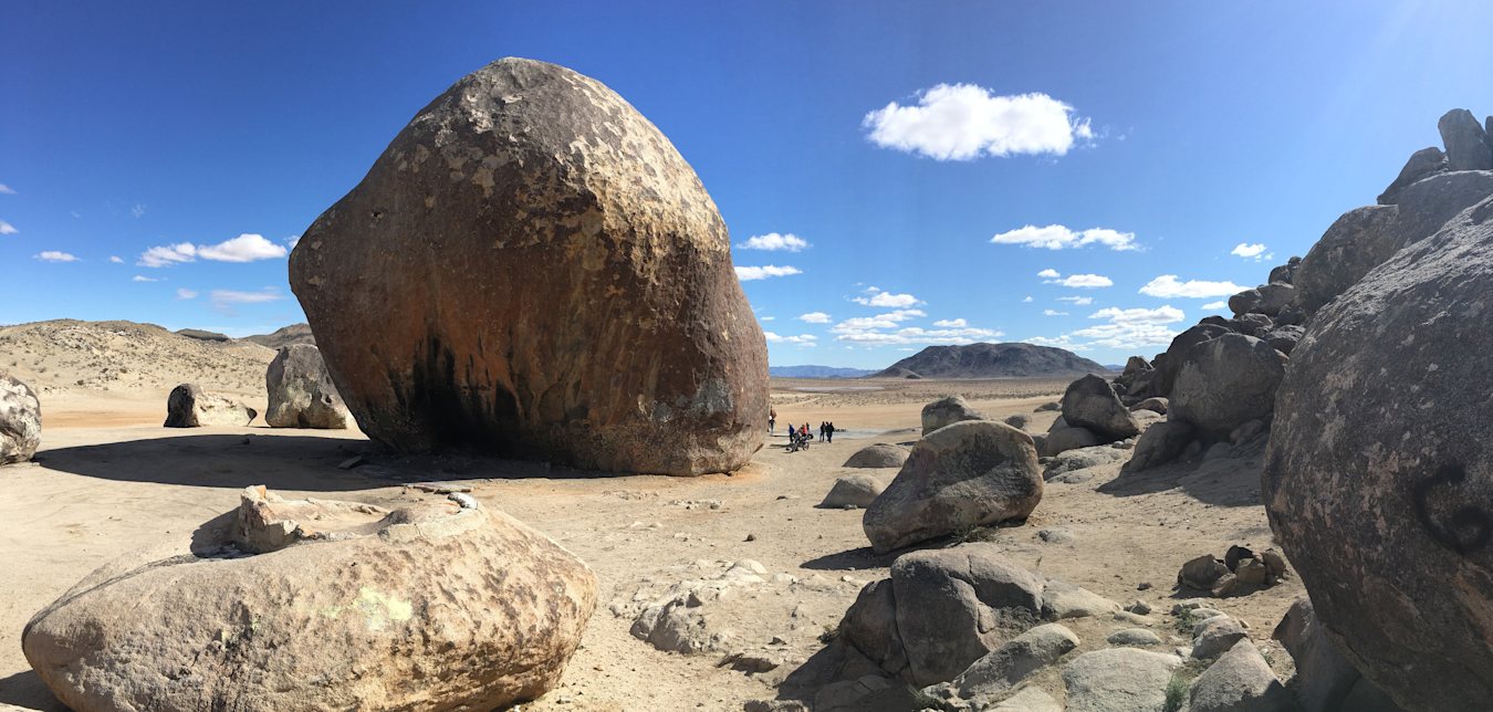 Giant Rock in front of a cloudy blue desert sky in Landers, CA