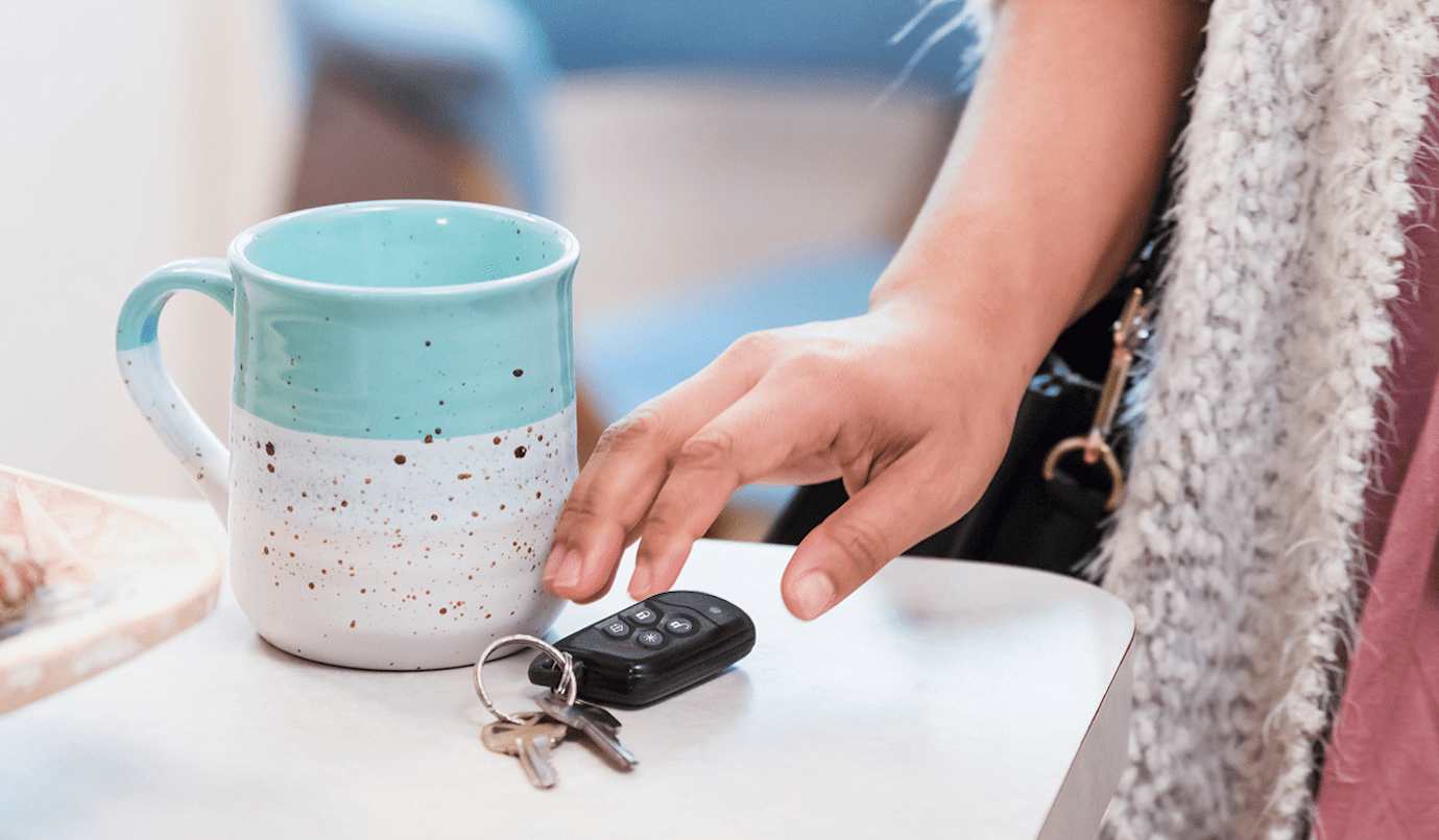 Person reaching for key fob