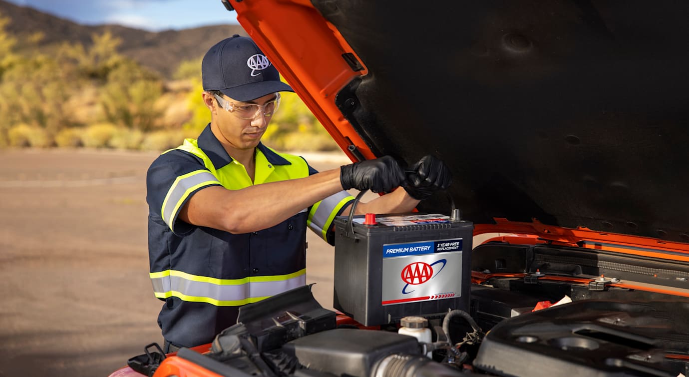 AAA technician helping replace battery